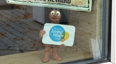 Morph holding a Living Wage employer logo