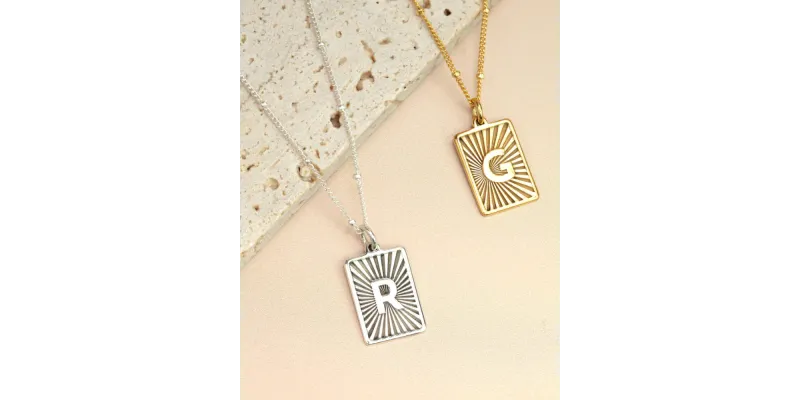 Starburst design necklaces in silver and gold