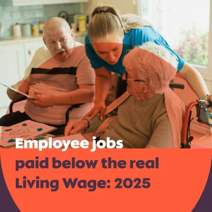 Cover image showing a caregiver in a blue uniform assisting an elderly woman in a wheelchair while speaking to her, with an older man sitting nearby holding a paper. Overlaid text reads “Employee jobs paid below the real Living Wage: 2025.” The Living Wage Foundation logo appears at the bottom left, and “Klervi Mignon, February 2026” is shown at the bottom right.