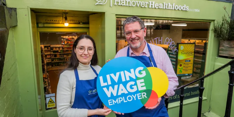 Hanover foods staff with Living Wage logo