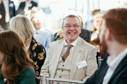 Man smiling at Champion Awards 2024