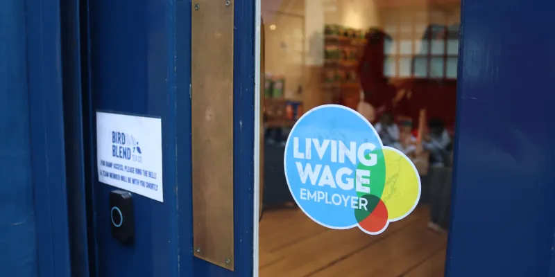 Living Wage sticker in window