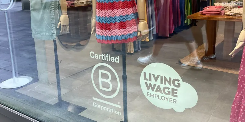 Living Wage logo in Omnes shopfront