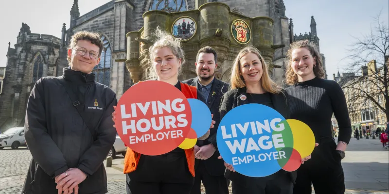 Mercat Tours with Living Hours and Living Wage logos