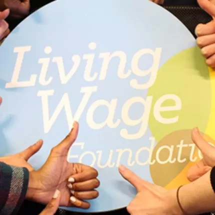 Living Wage Foundation Logo Surrounded by 'Thumbs Up'