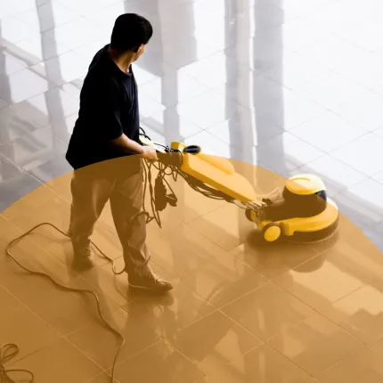 Women cleaning shiny office floor with vacuum cleaner
