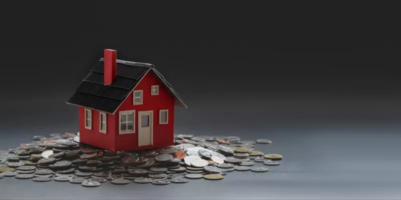 House on a pile of coins